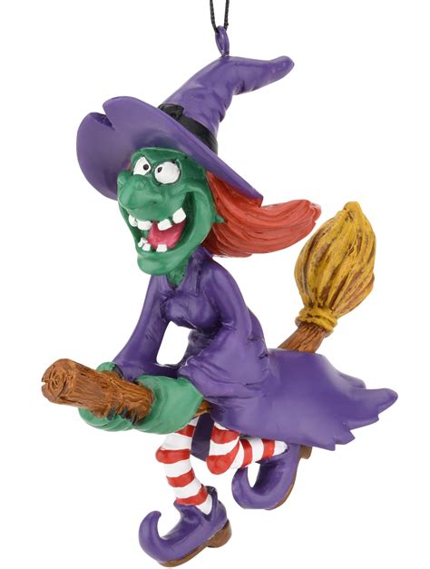 Halloween witch ornament colliding with a tree